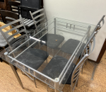 Lasipöytä ja 4 kpl tuoleja